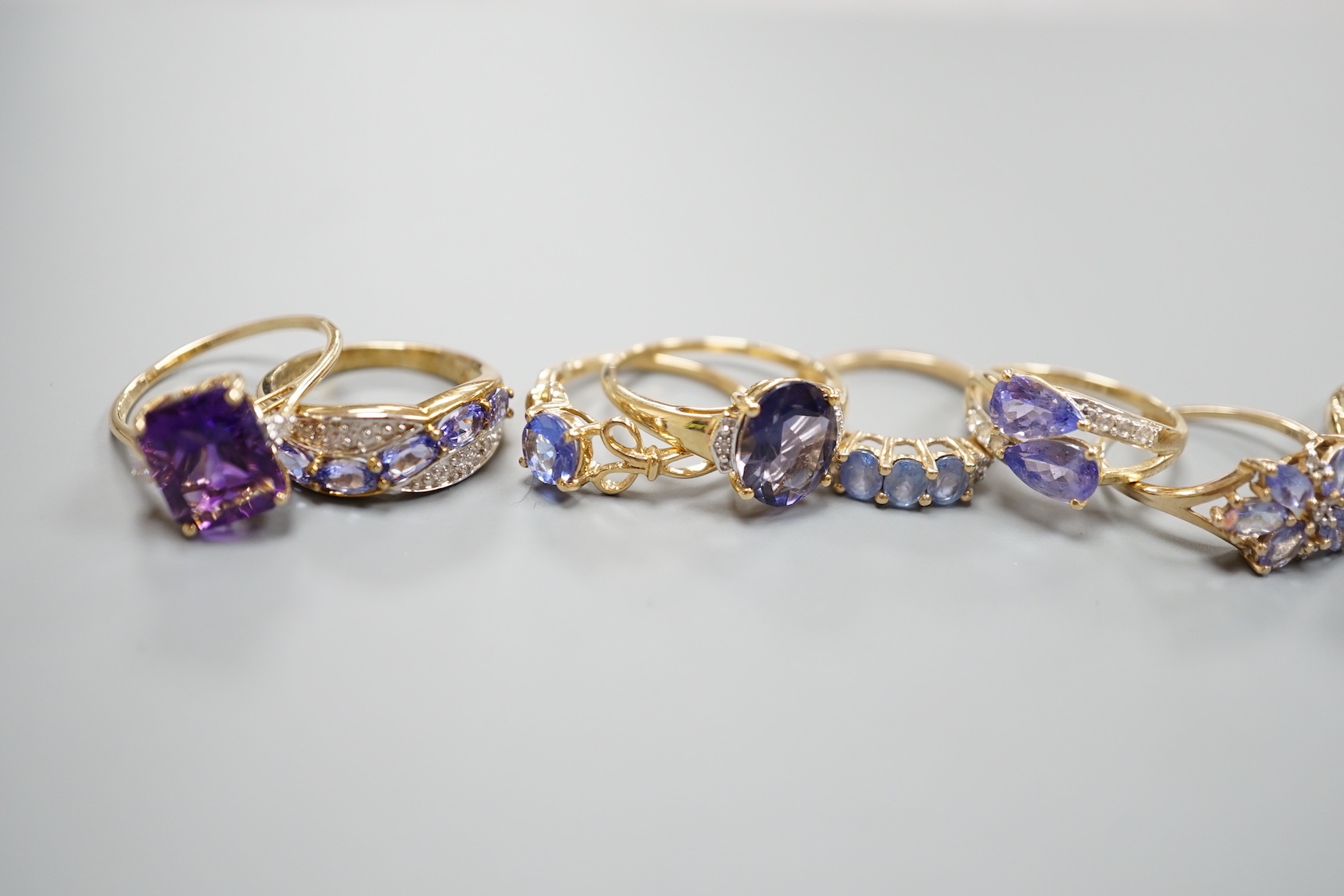 Six assorted modern 9ct gold gem set rings, including amethyst, gross 13.9 grams, a similar 14ct gold ring, gross 2.5 grams and a 925 ring.